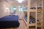 Main level queen bedroom and AC, ceiling fan, flat screen TV with cable